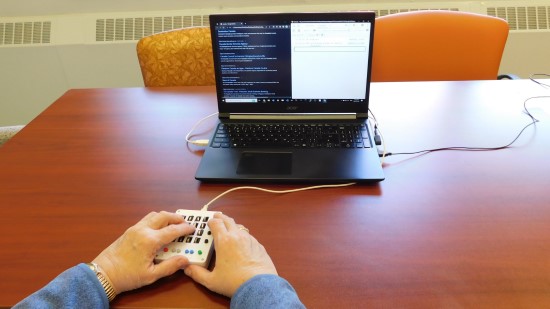 Photo of visually impaired user using tomat navigator